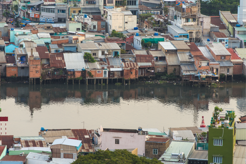 Poor houses in Ho Chi Minh Riverside cityscape